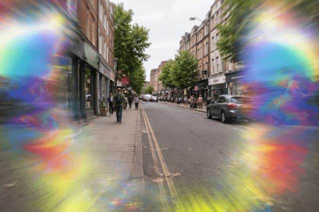 Simulation of migraine visual aura showing shimmering colorful distortions in peripheral vision